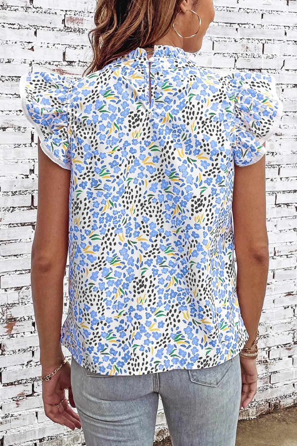 Light blue abstract print flutter sleeve top, styled on model