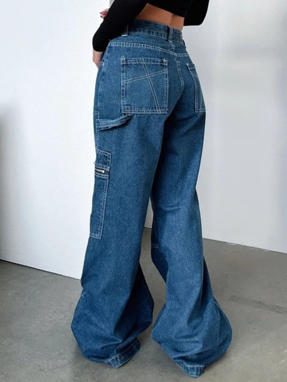 Dark wash wide leg cargo jeans full length view