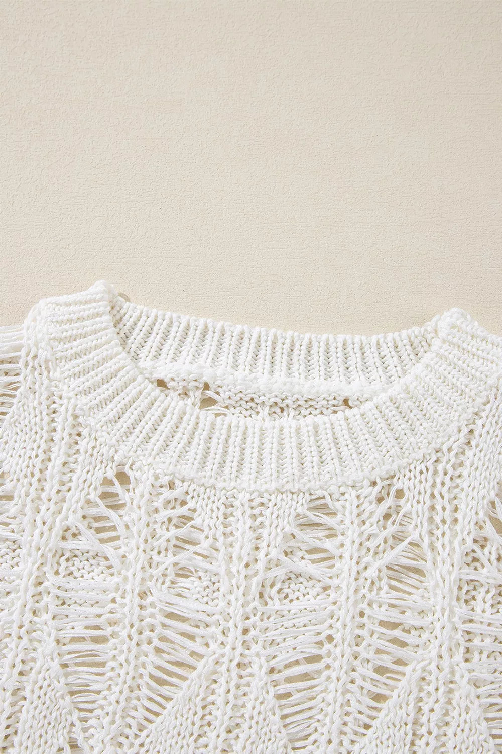 White knit cover up on model