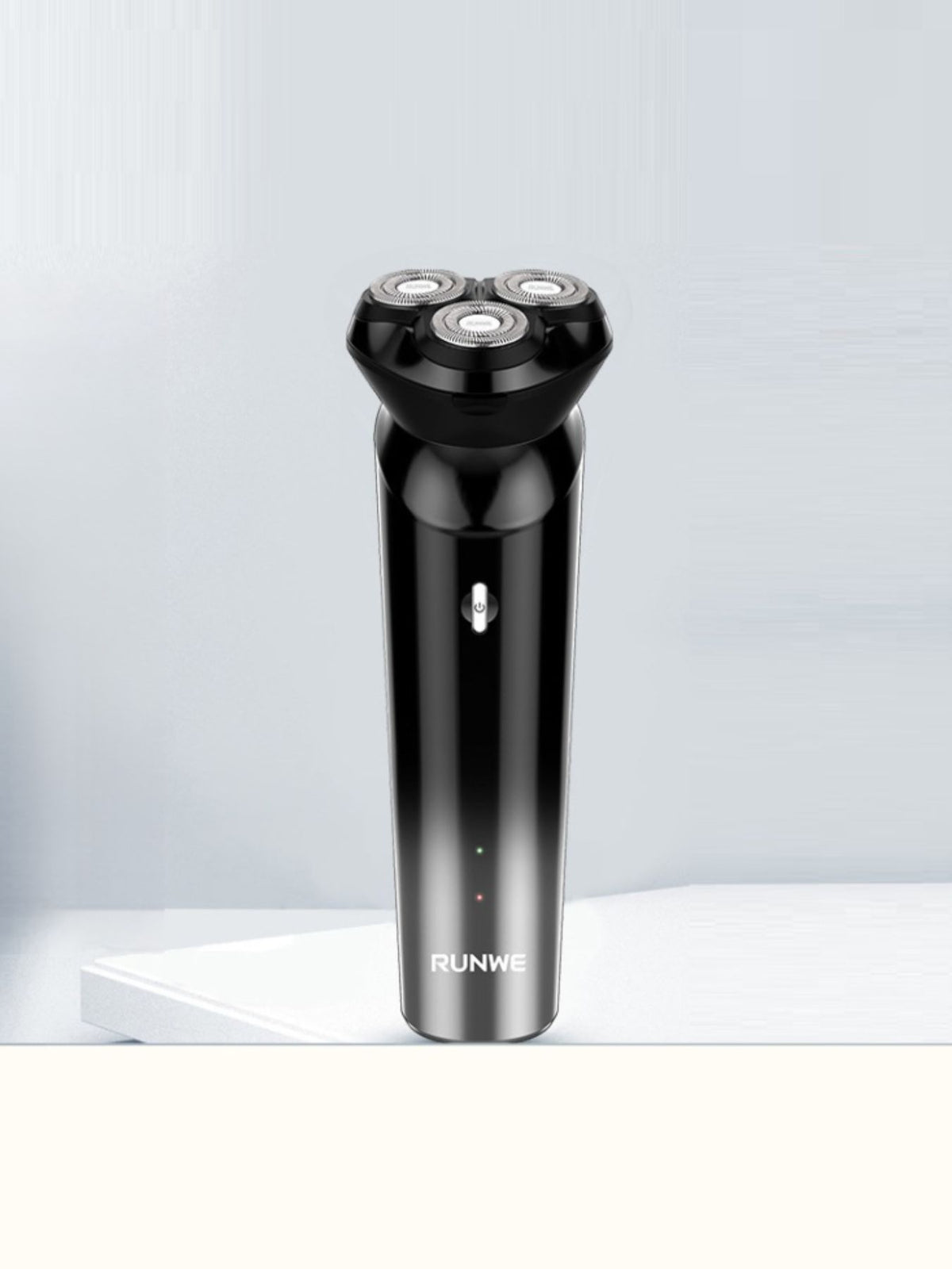 Shaver being rinsed under water