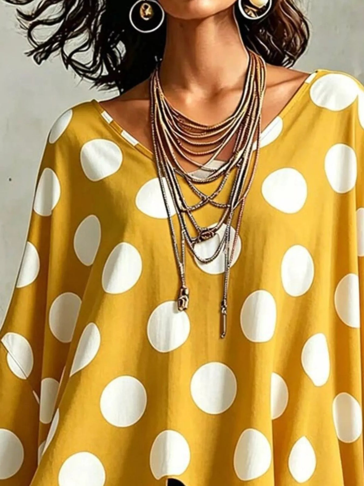 Side view showing the drape of the longline blouse