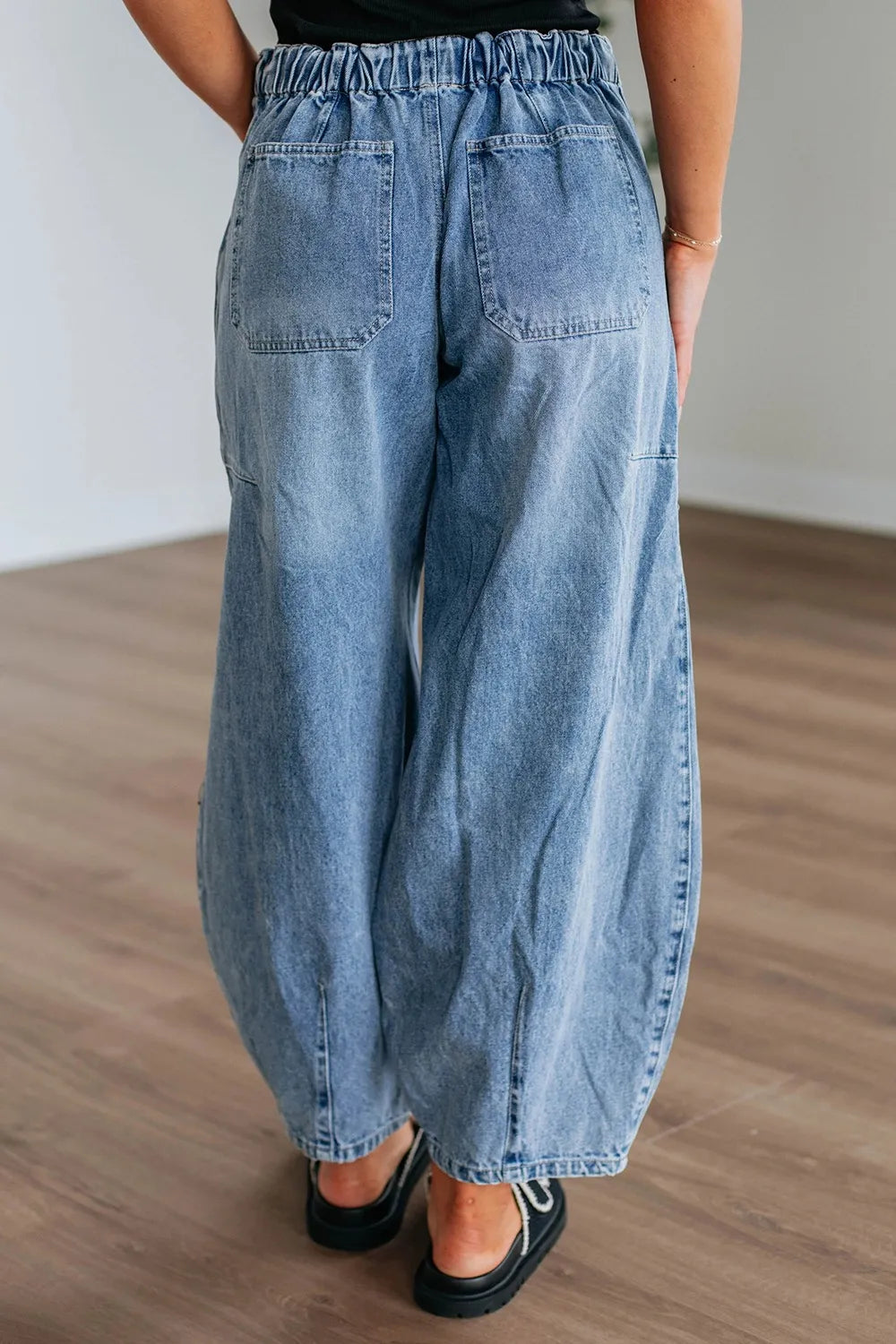 Medium wash wide leg jeans side profile