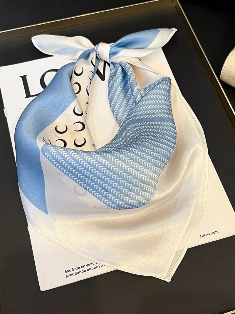 Printed silk square scarf tied at the neck