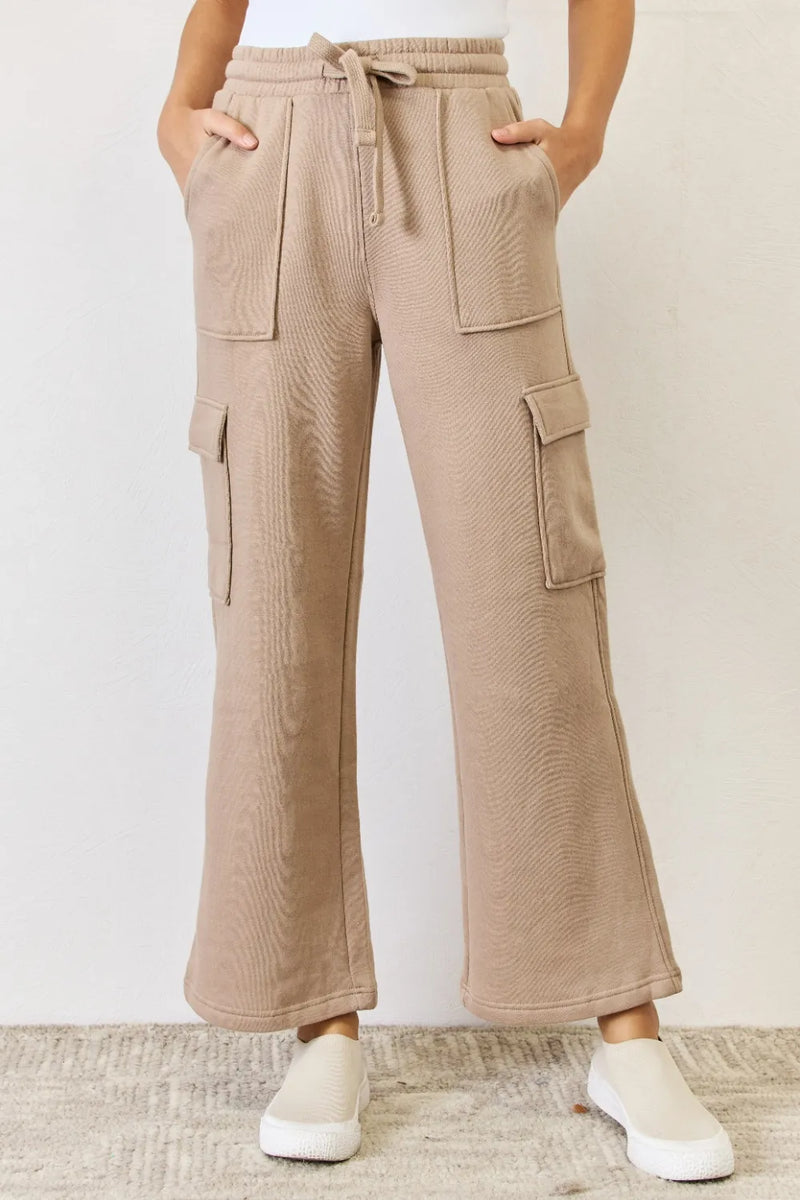 Tan wide leg cargo pants front view on model