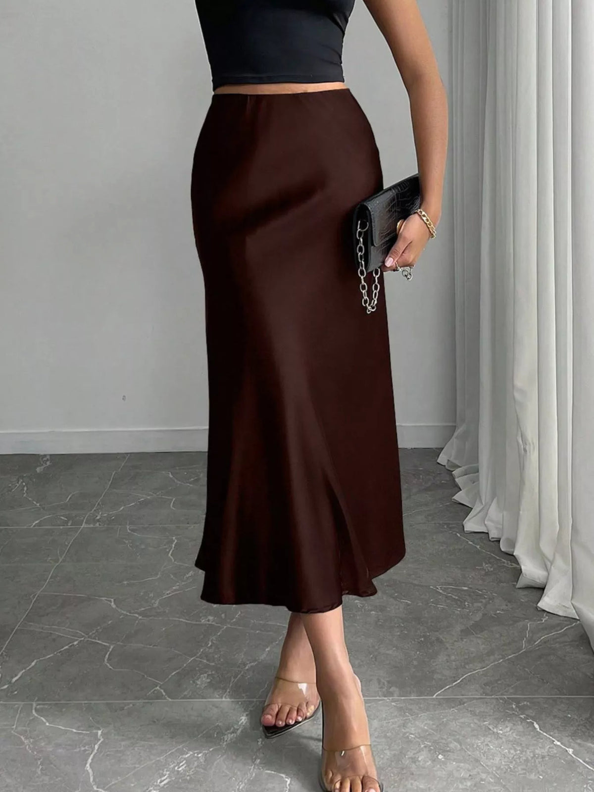 Satin skirt hemline and midi length detail