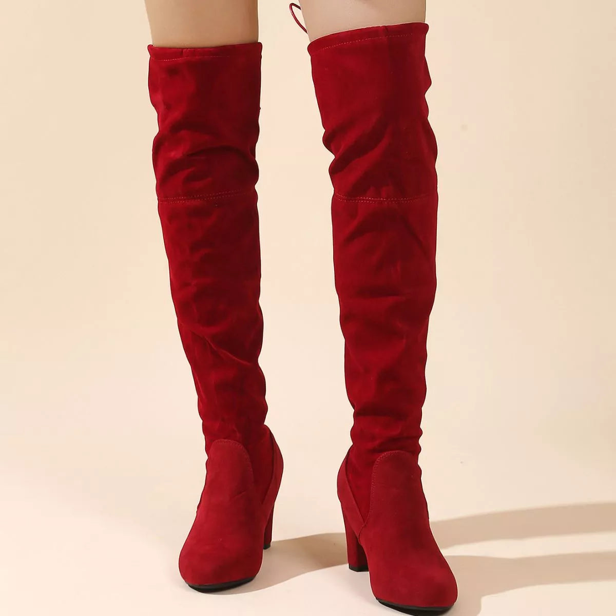 Over the knee high heel suede boots texture close up