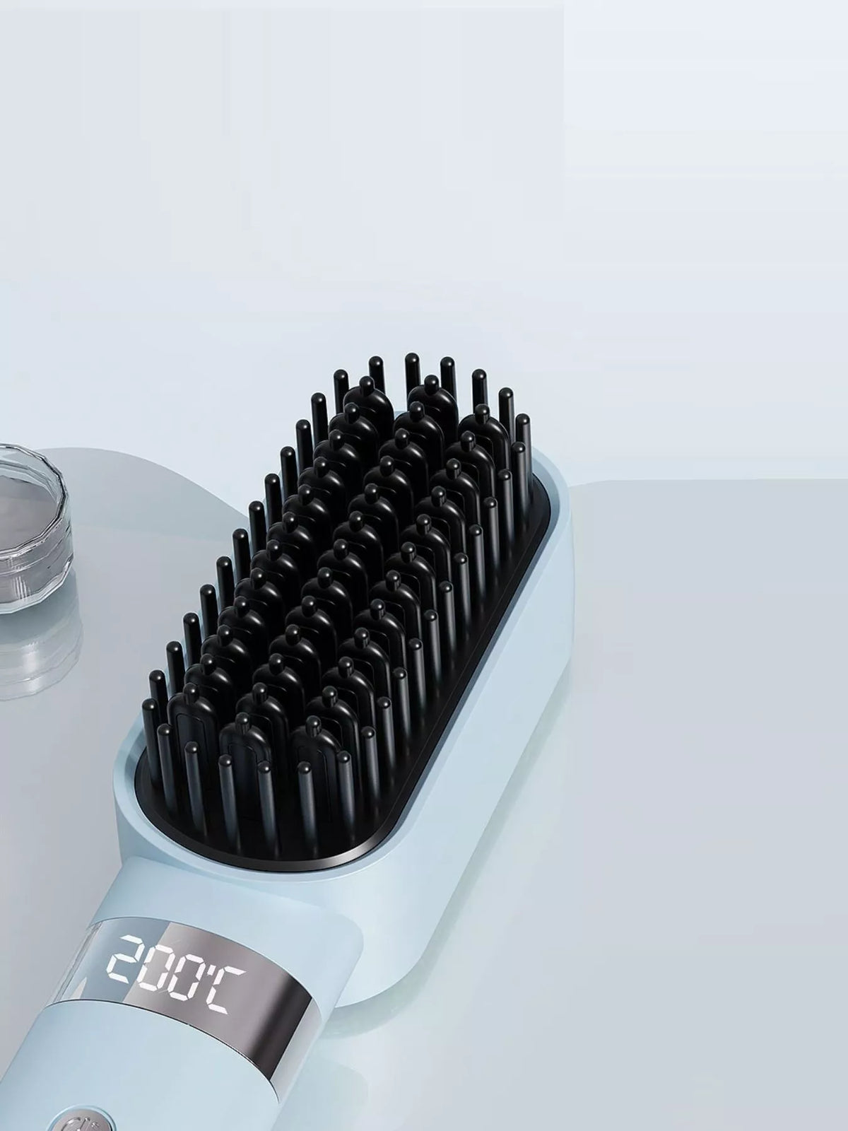 Heated comb held in hand
