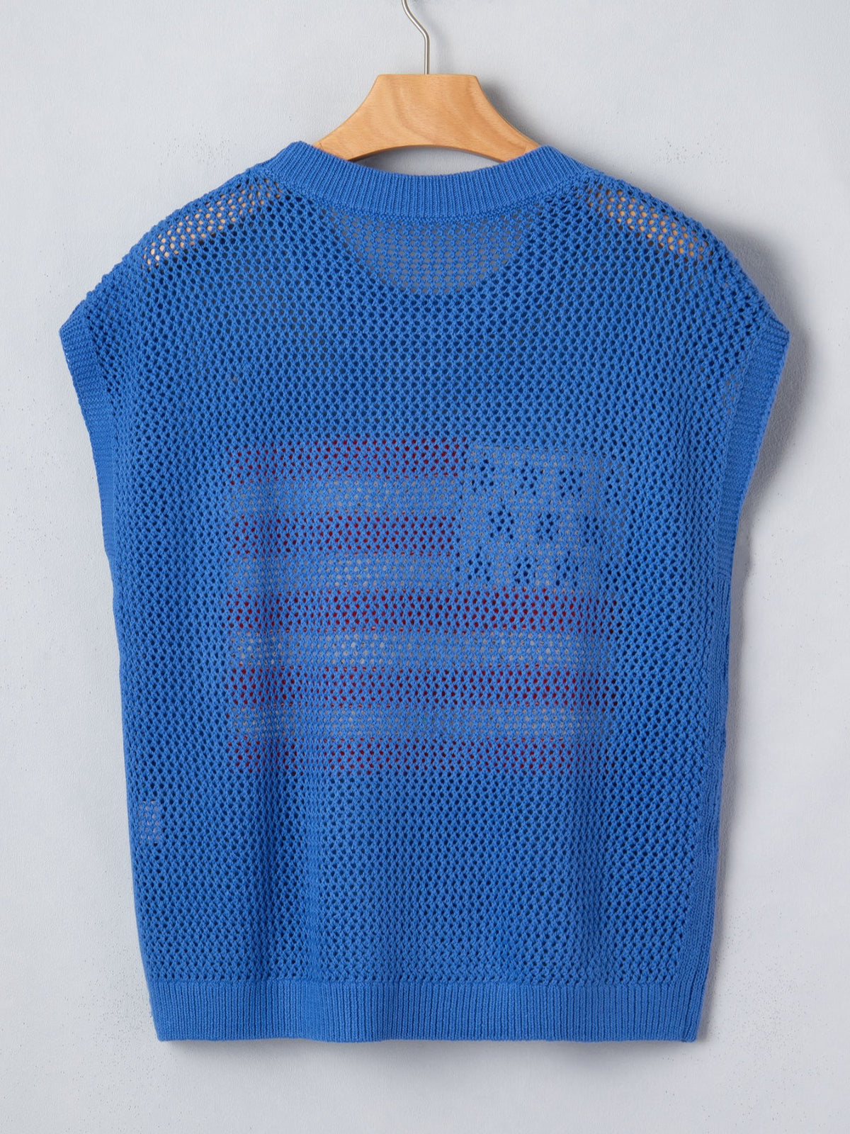 Dusty blue sweater top flag graphic detail