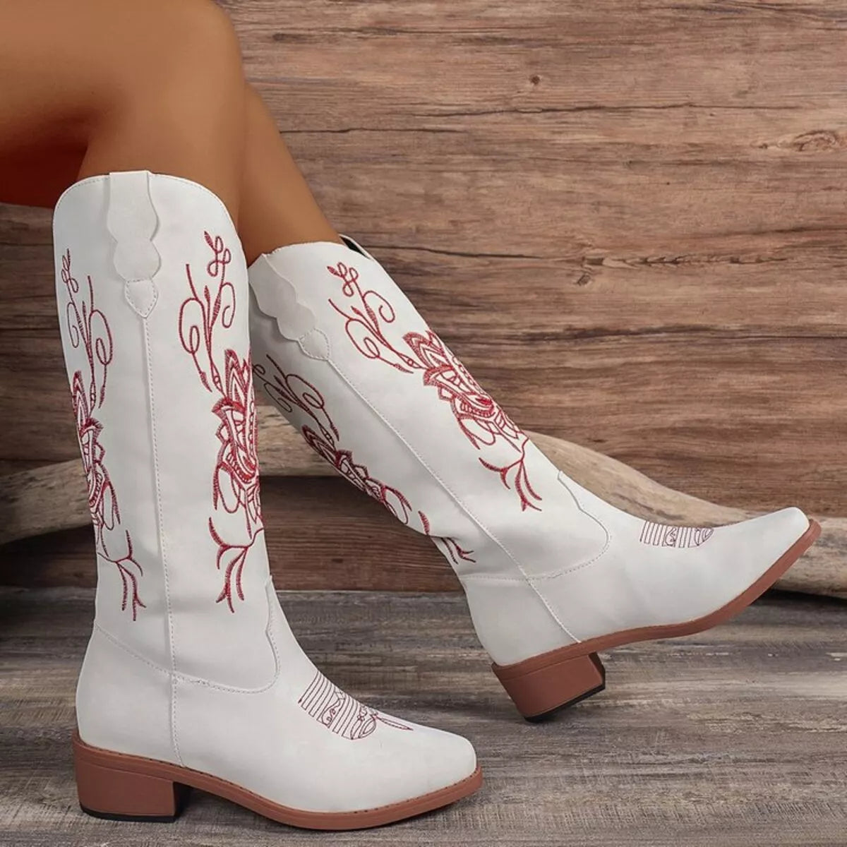 Embroidered western block heel boots pair standing