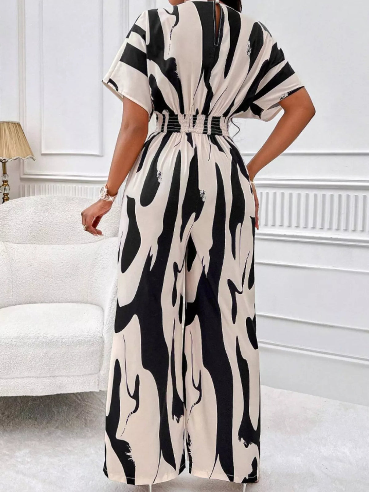 Abstract print wide leg jumpsuit with ruched bodice detail view