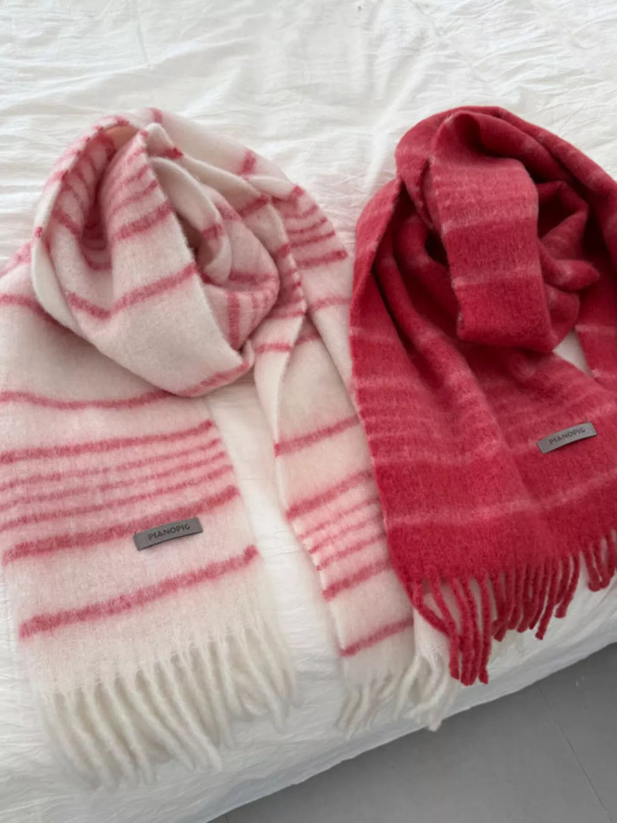 Detail of the soft fringe hem on the striped scarf