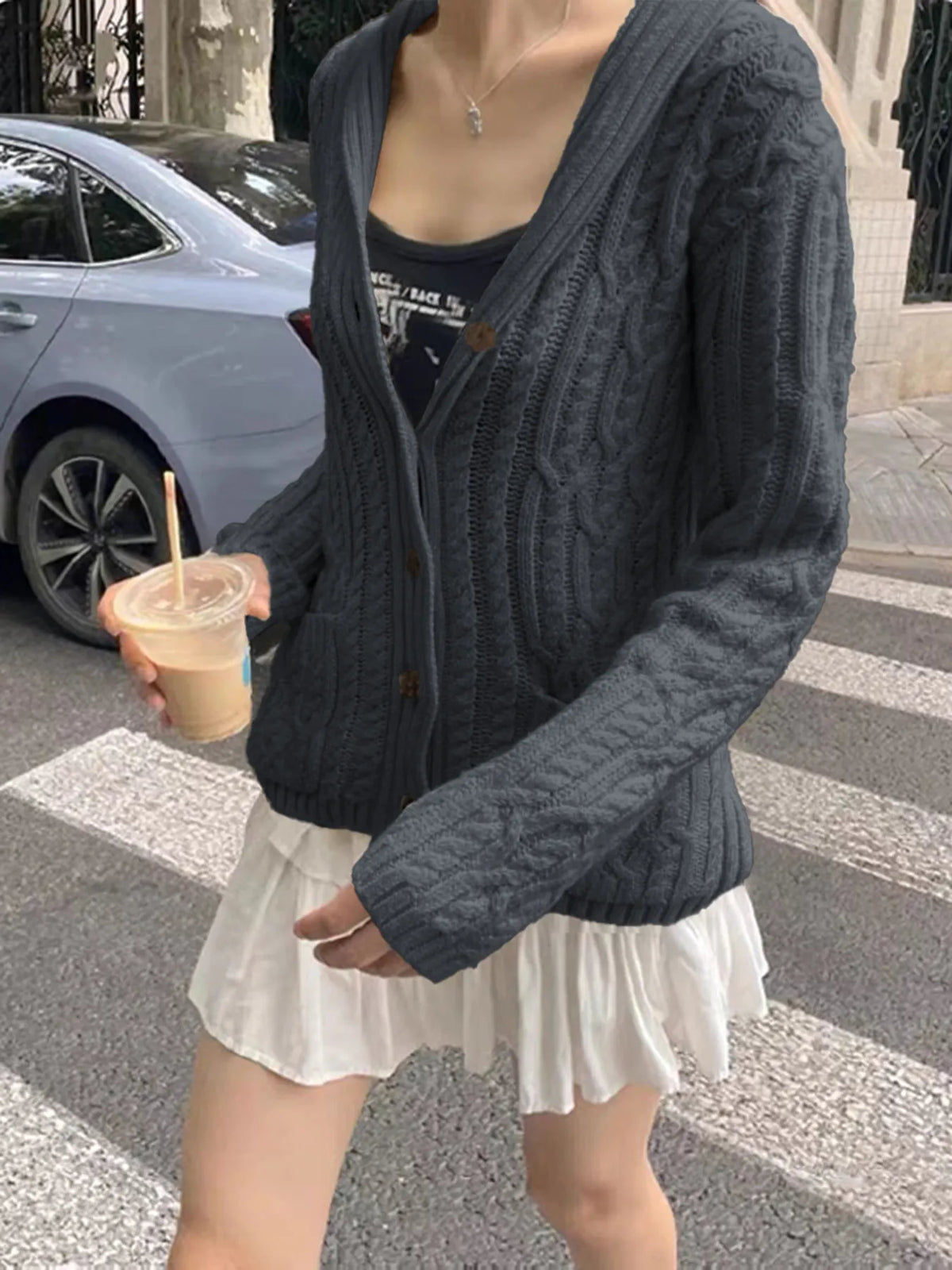 cable knit button up cardigan hem detail