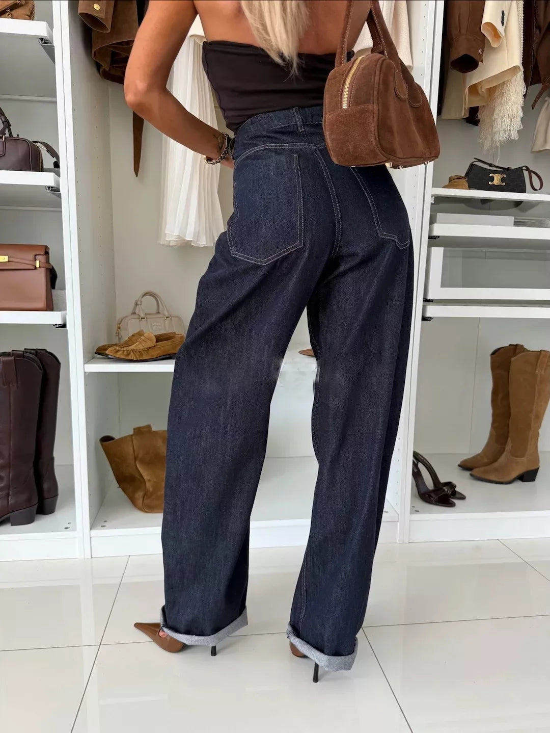 Dark navy wide leg jeans on model full length