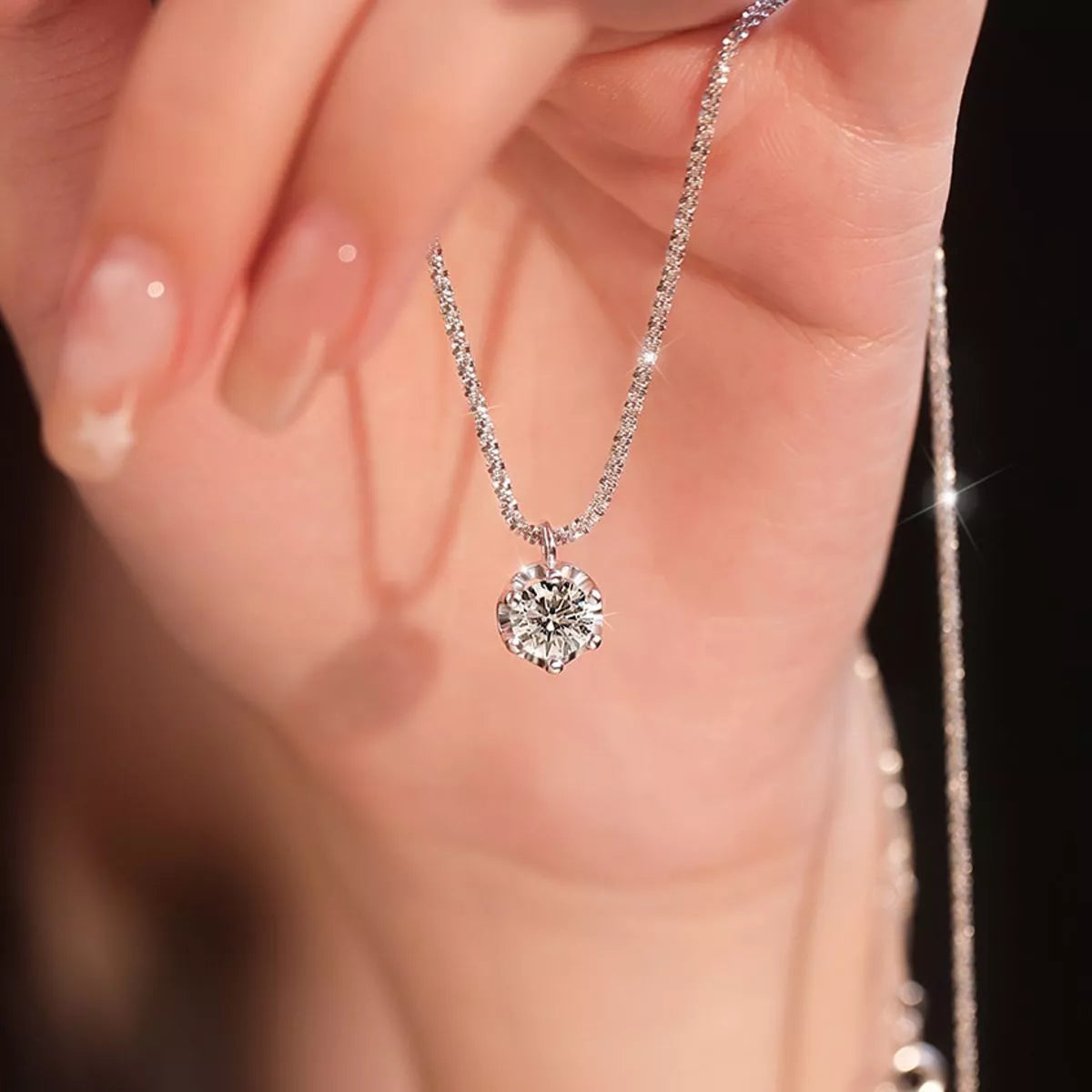 Close up of the moissanite stone and silver setting