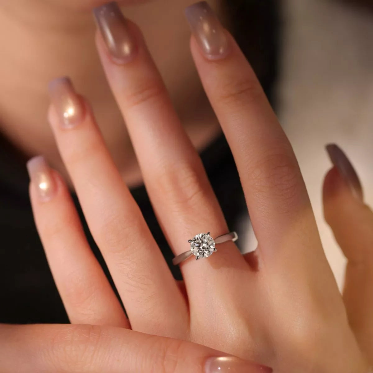 Close up of the moissanite stone and silver band