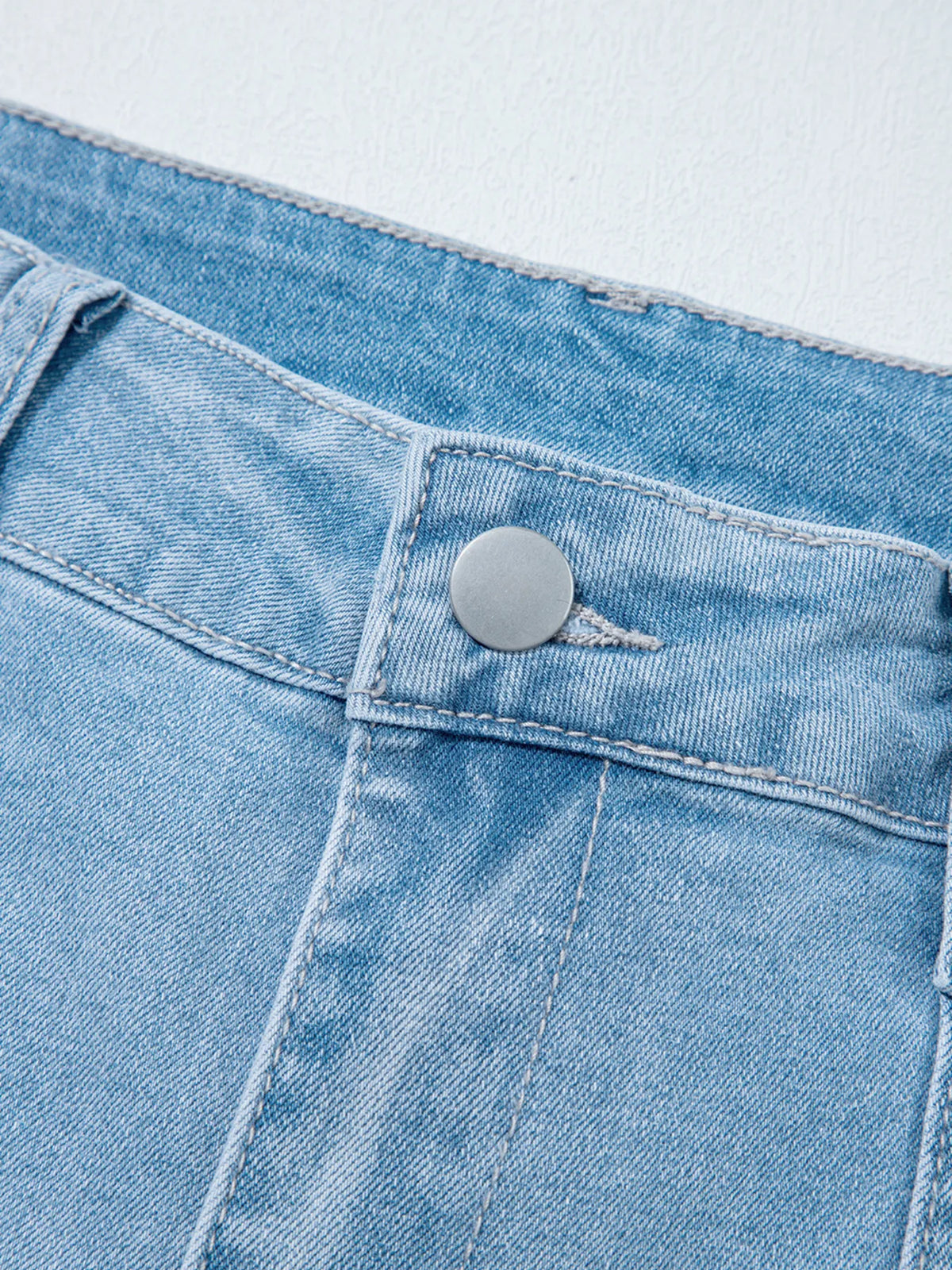 Patch pocket detail on barrel denim