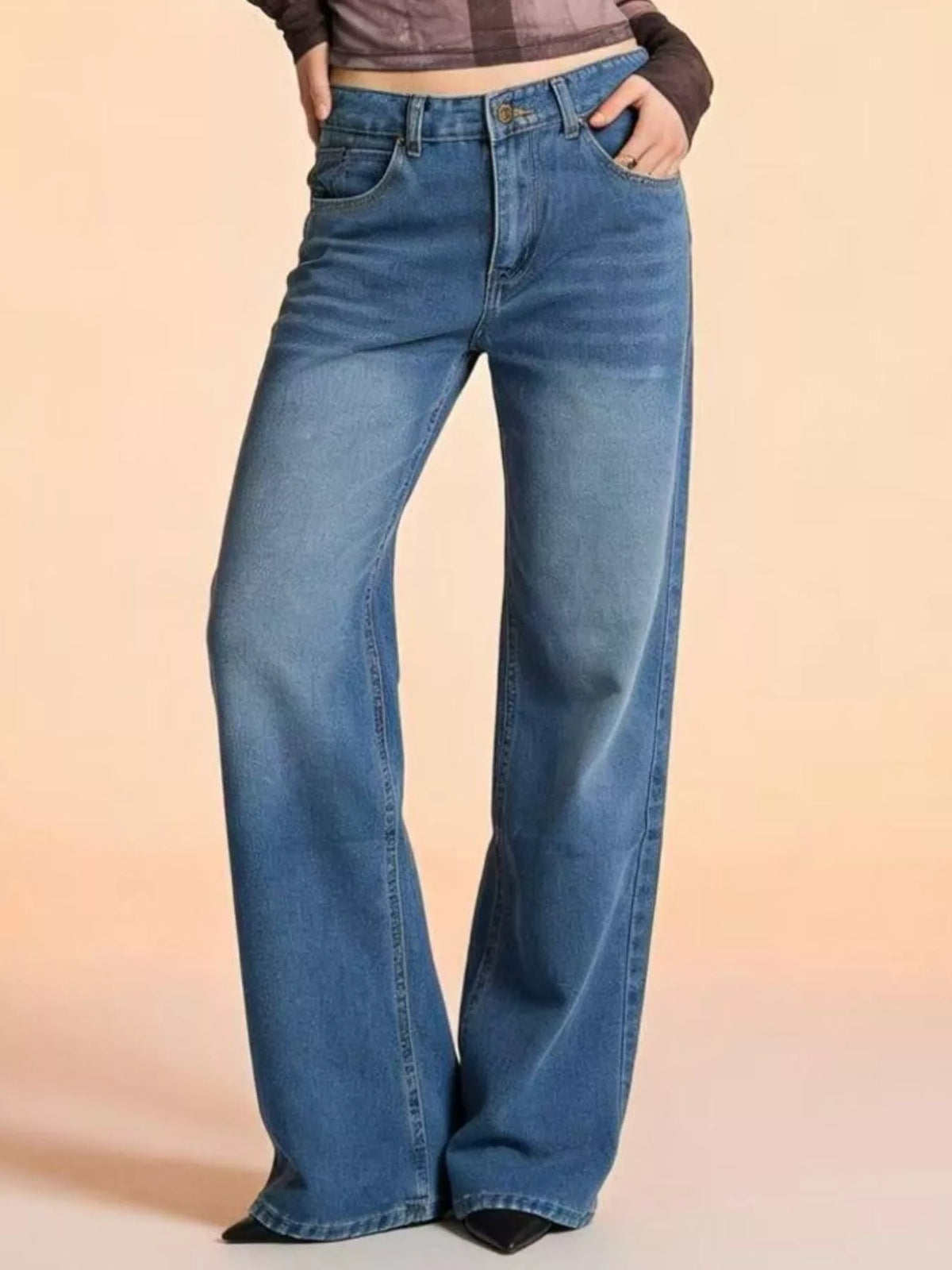 Side profile of roomy vintage wash jeans