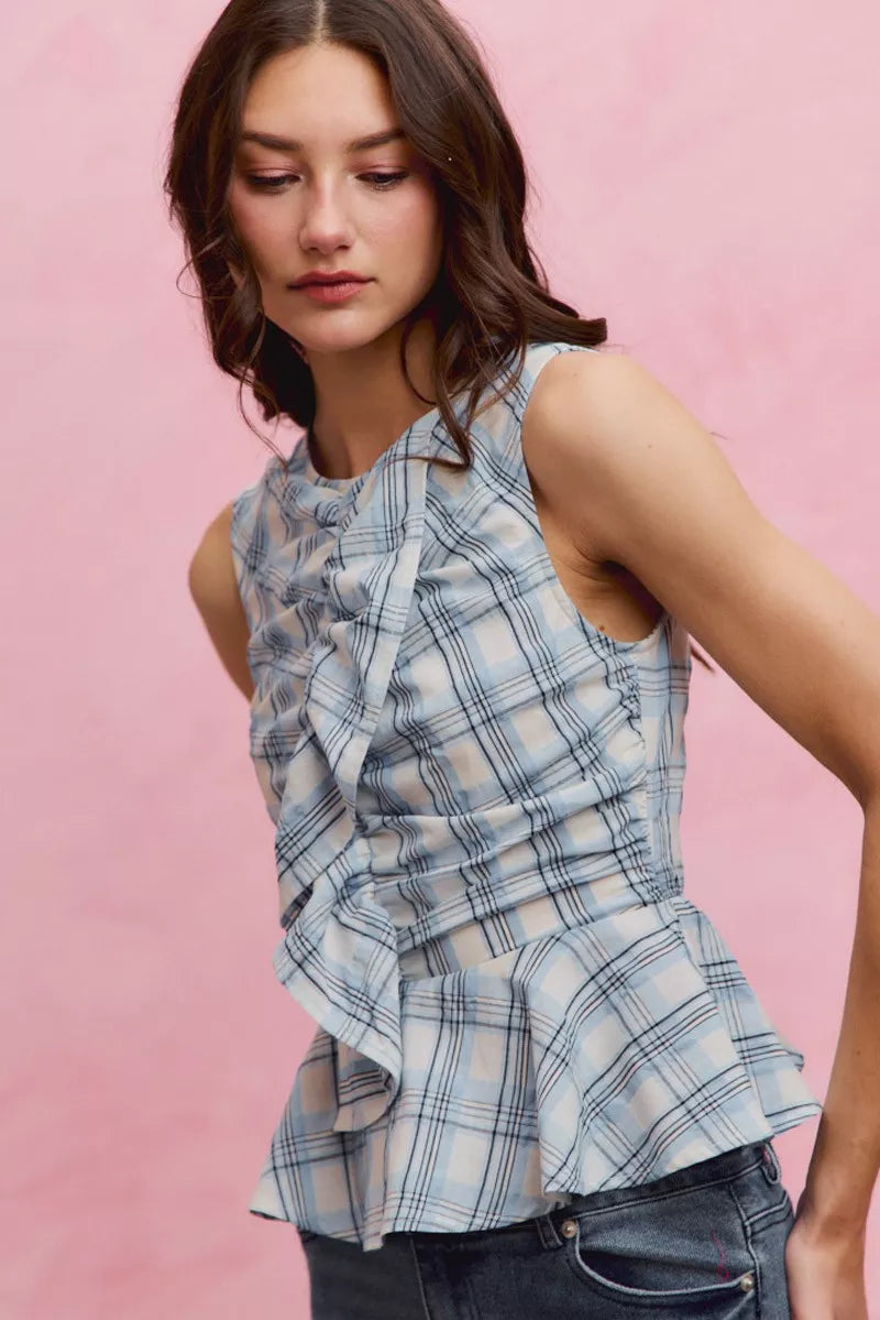 Blue plaid sleeveless ruffle peplum top front view
