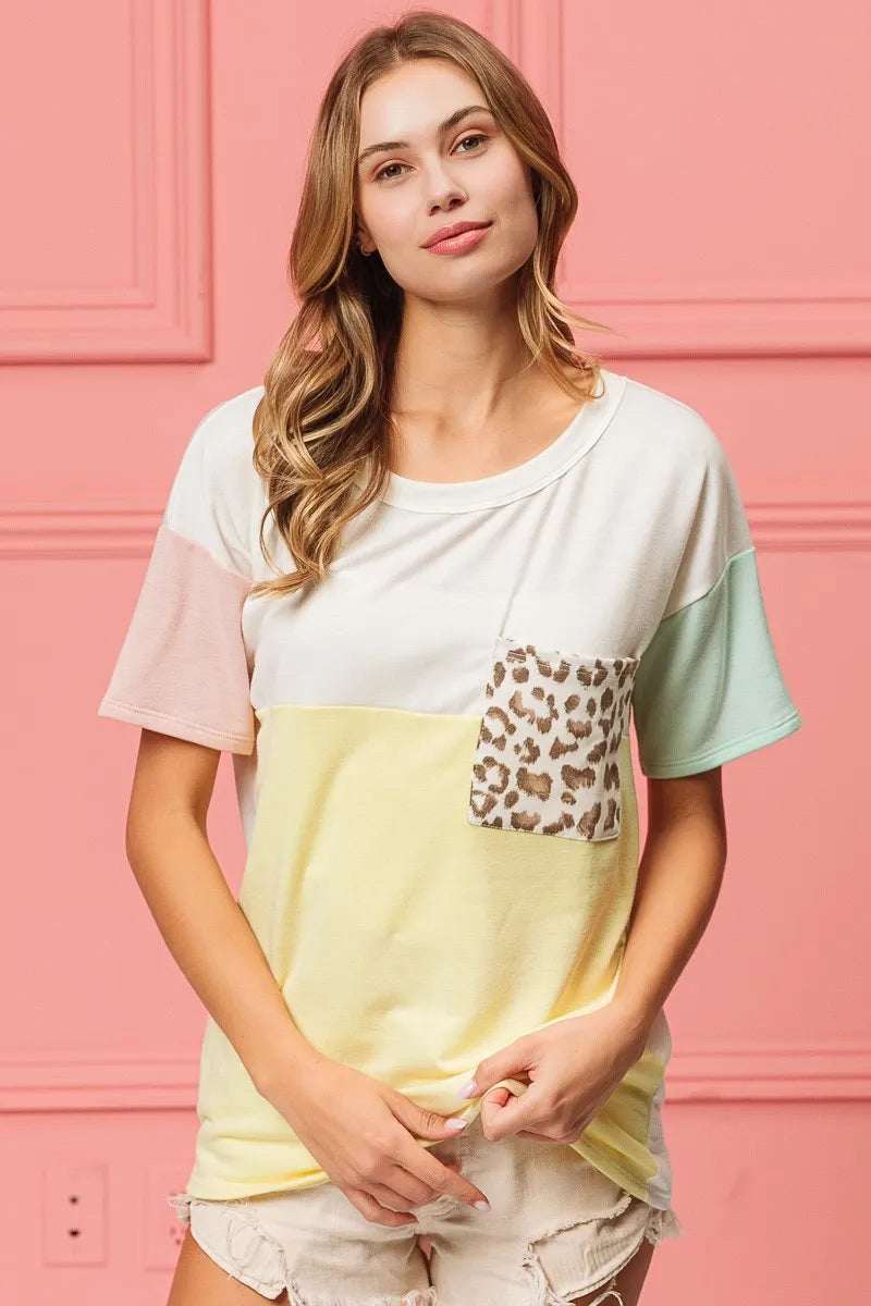 Yellow mint and blush color block crew neck top with leopard pocket front view