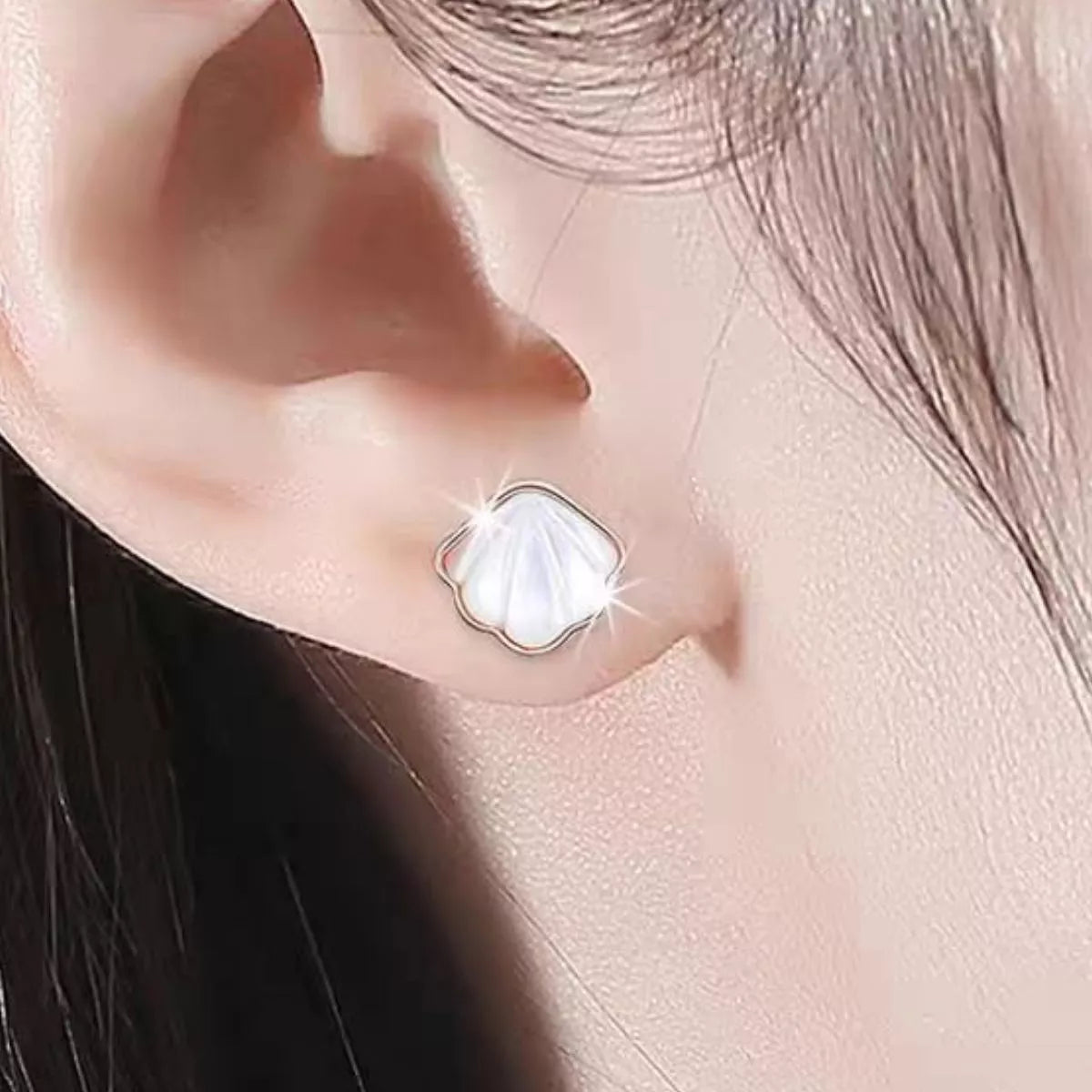 Sterling silver shell studs shown from above