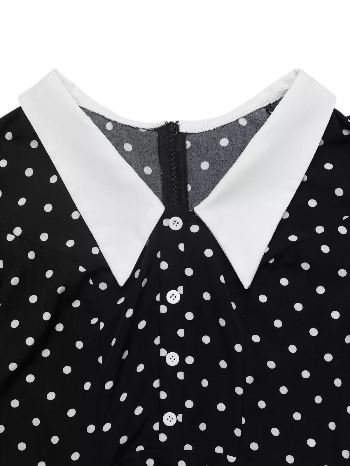 Three quarter view of the collared polka dot dress
