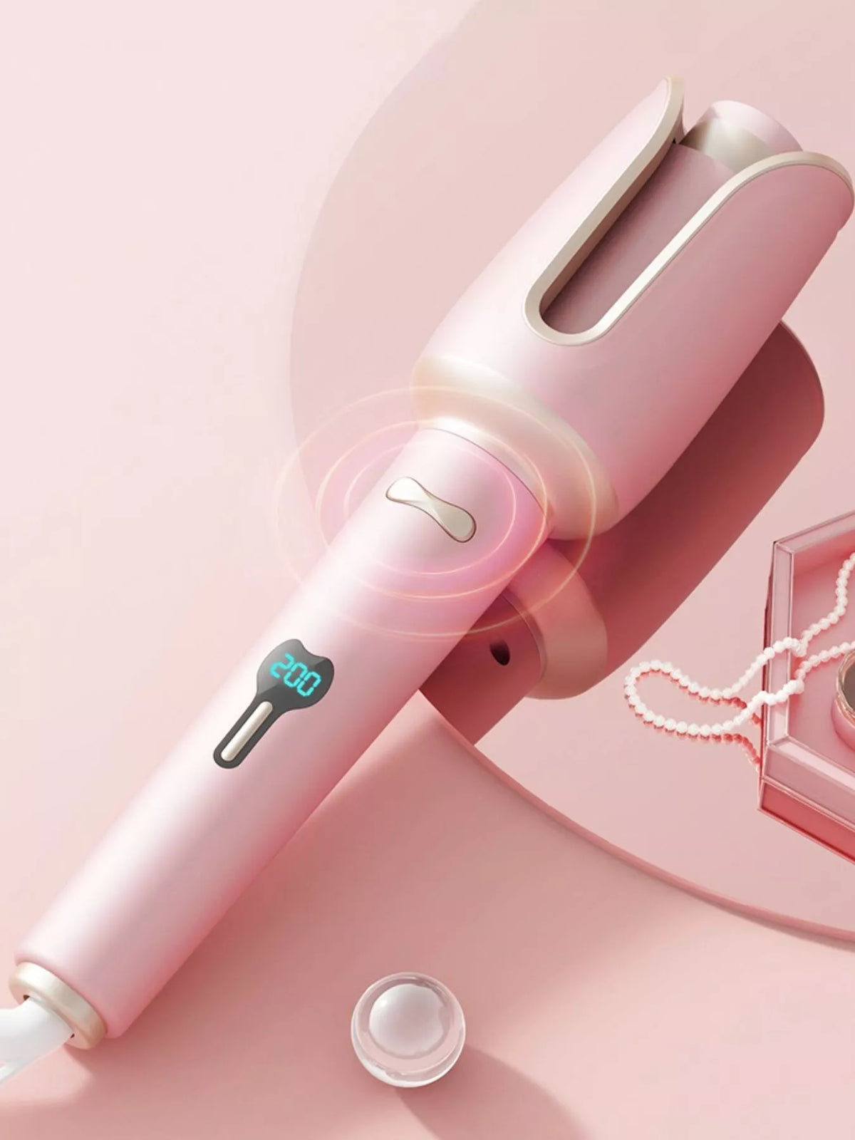 Curling iron in beige color