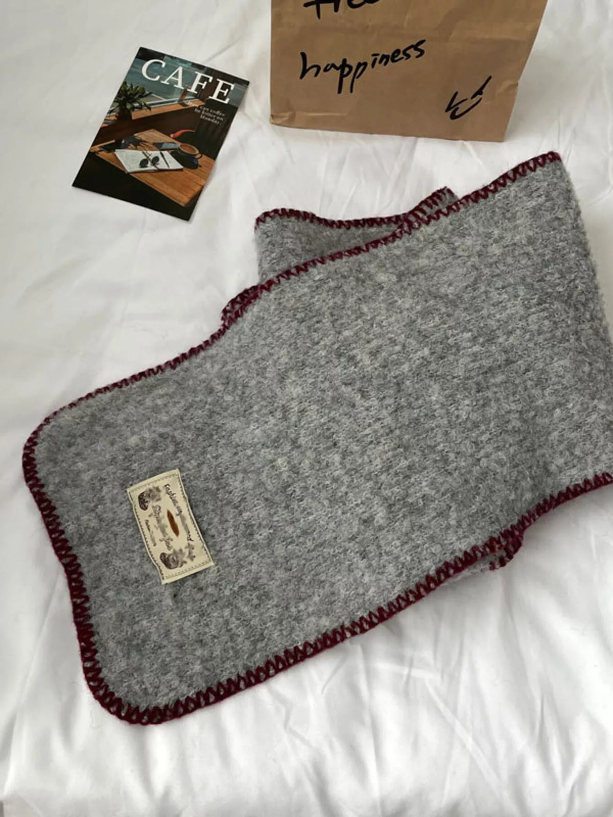 Contrast trim scarf shown in natural light