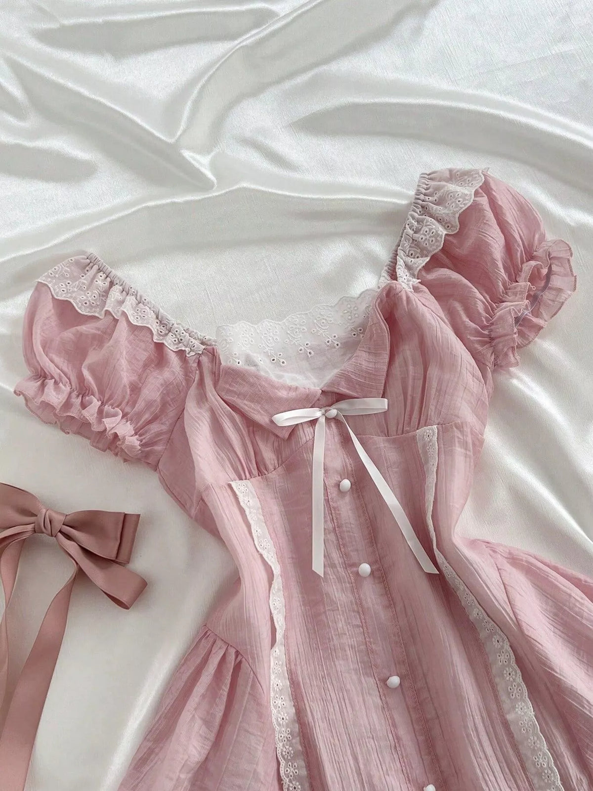 Pink lace dress styled with the hem above the knee