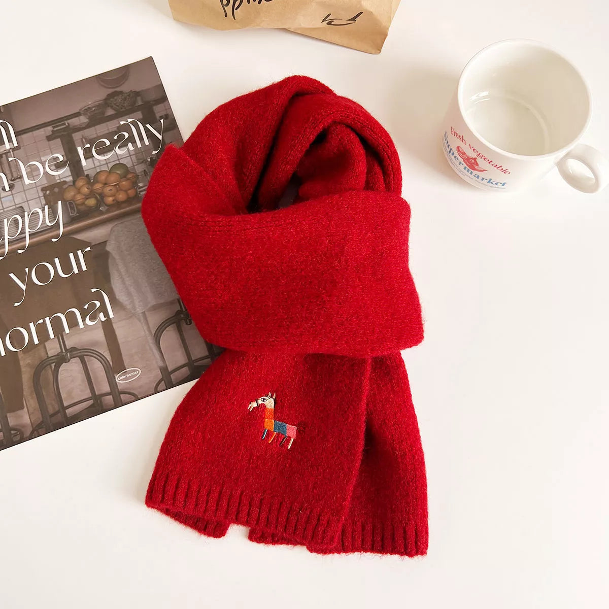 Embroidered warm winter scarf shown around the neck