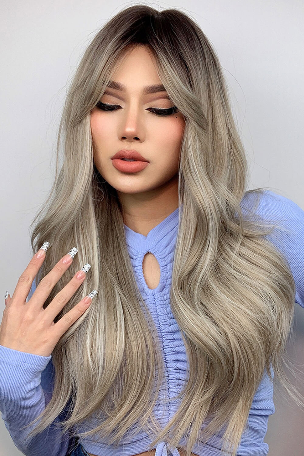 Model wearing the long wavy synthetic wig