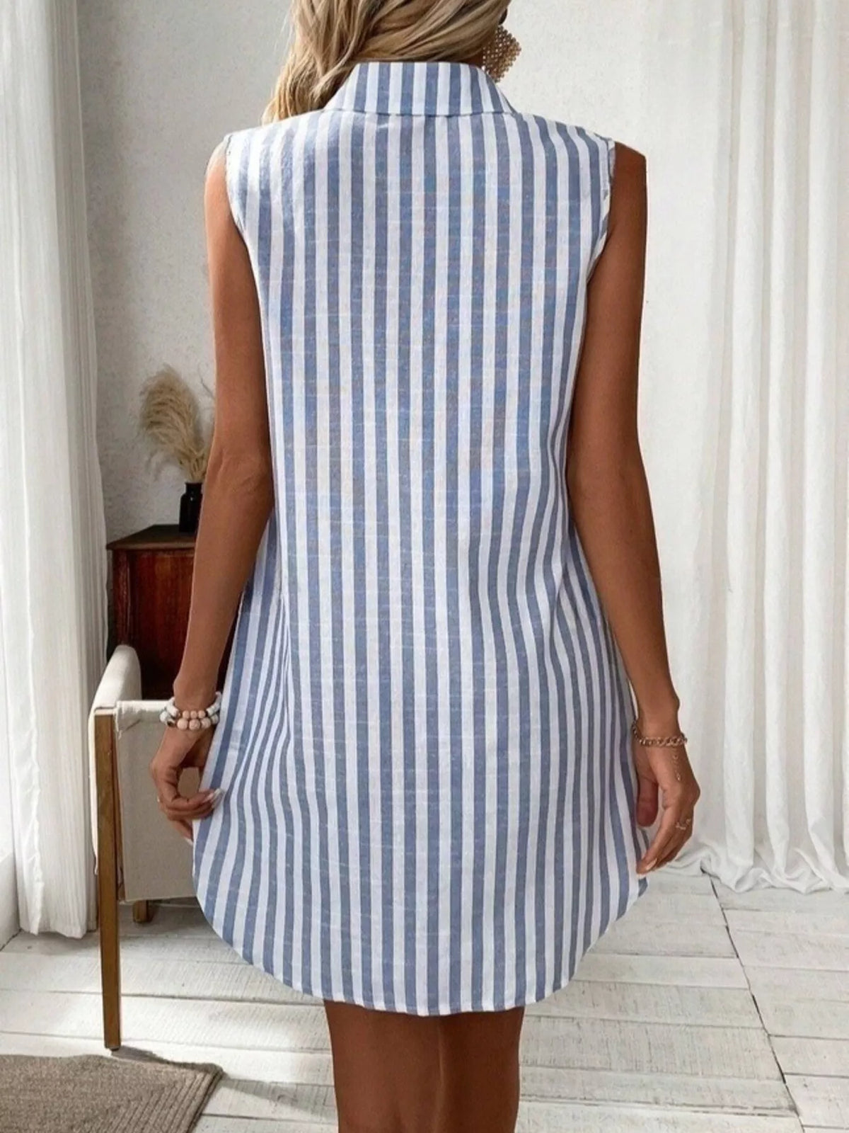 Blue striped sleeveless button front shirt dress front view