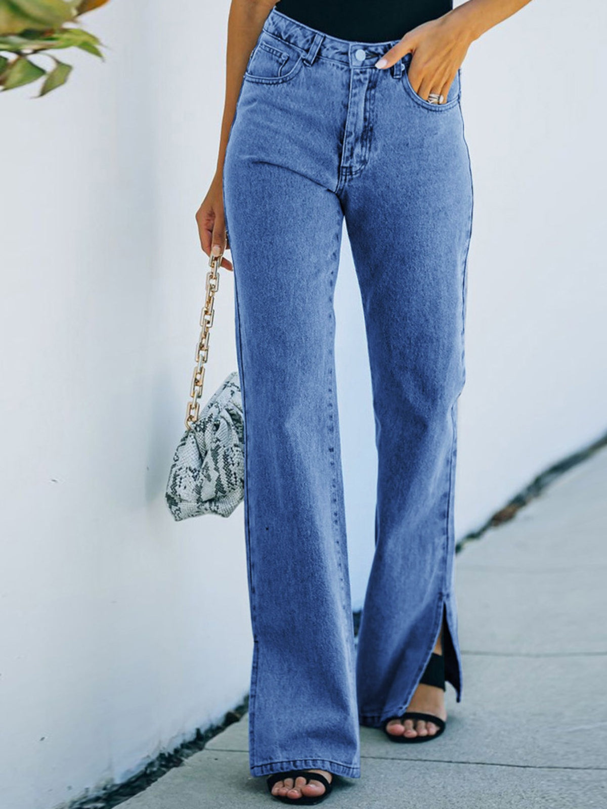 Dusty blue slit hem jeans front view