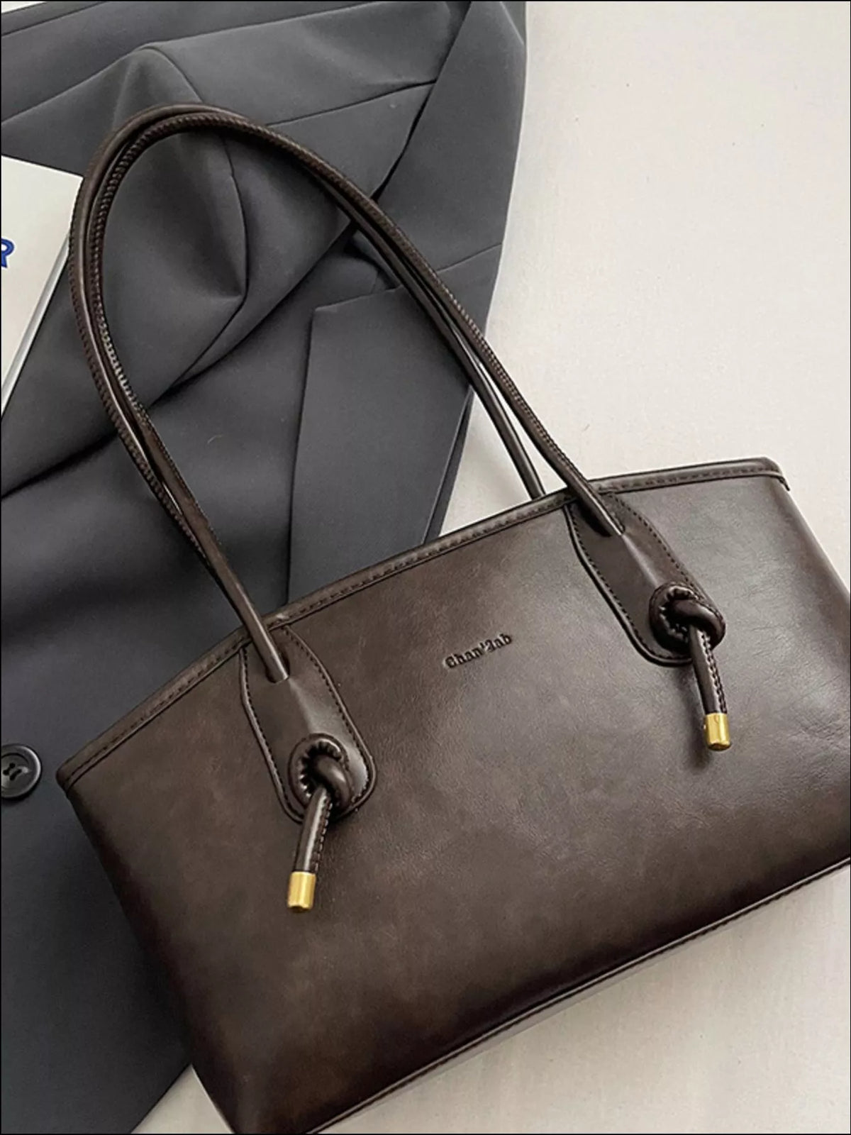 Leather shoulder bag hardware close up