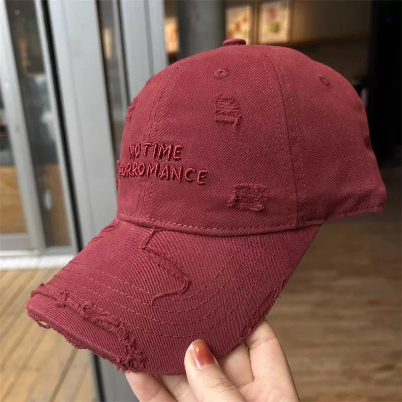Distressed cap in a neutral colorway