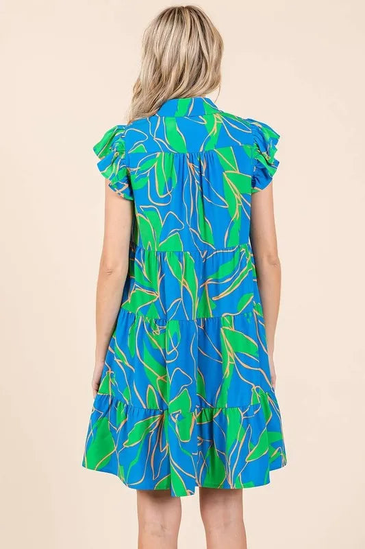Tiered leaf print mini dress side view on model