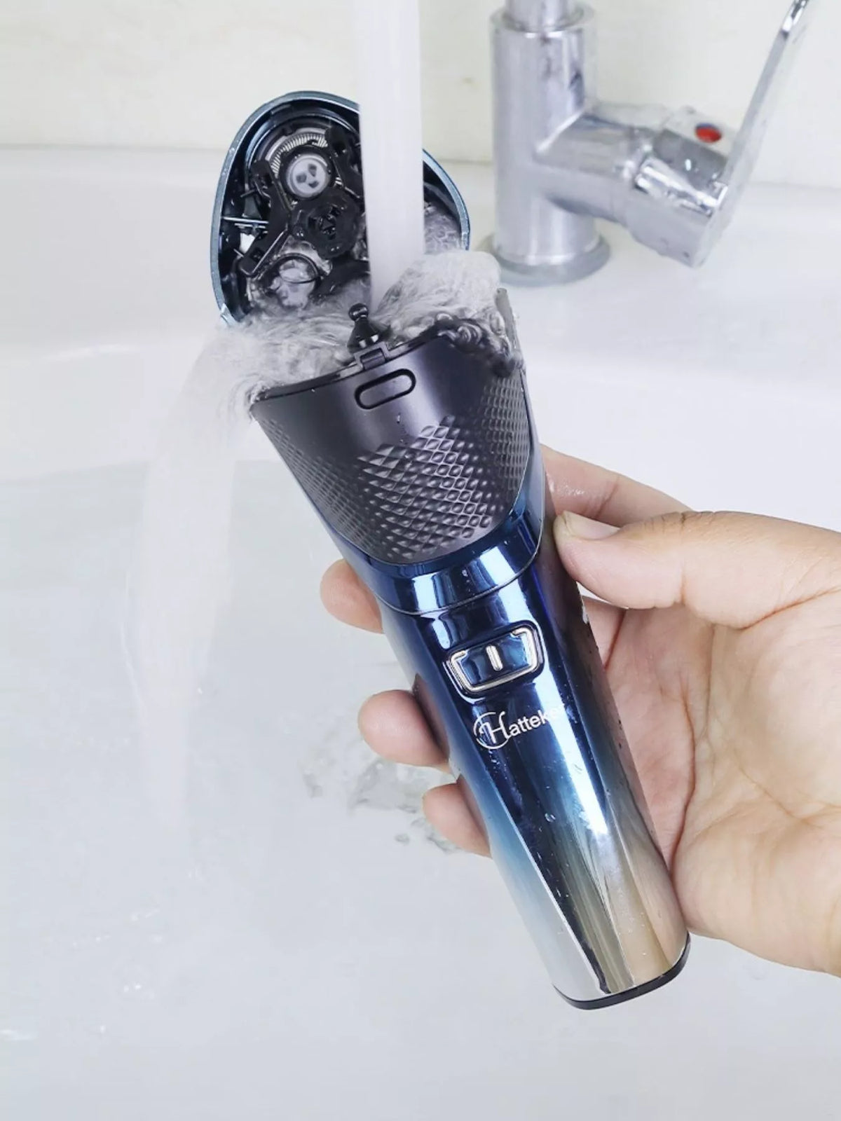 Cordless shaver held in hand
