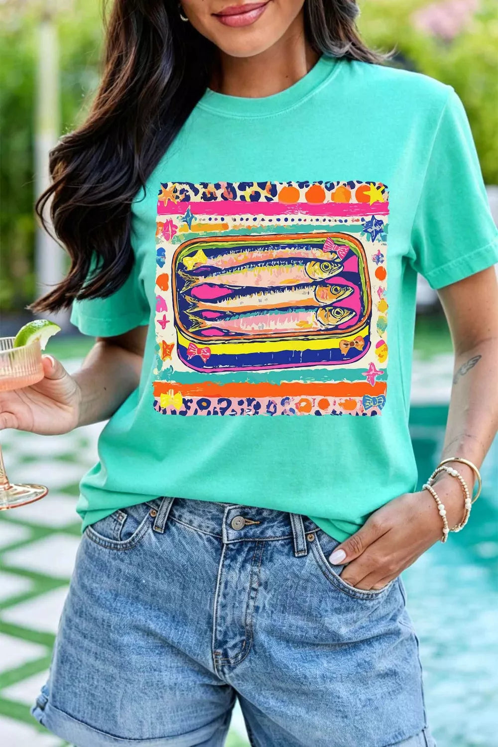 Short sleeve and neckline detail on the turquoise tee