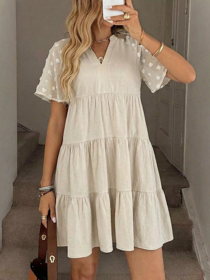 Apricot tiered swiss dot mini dress front view
