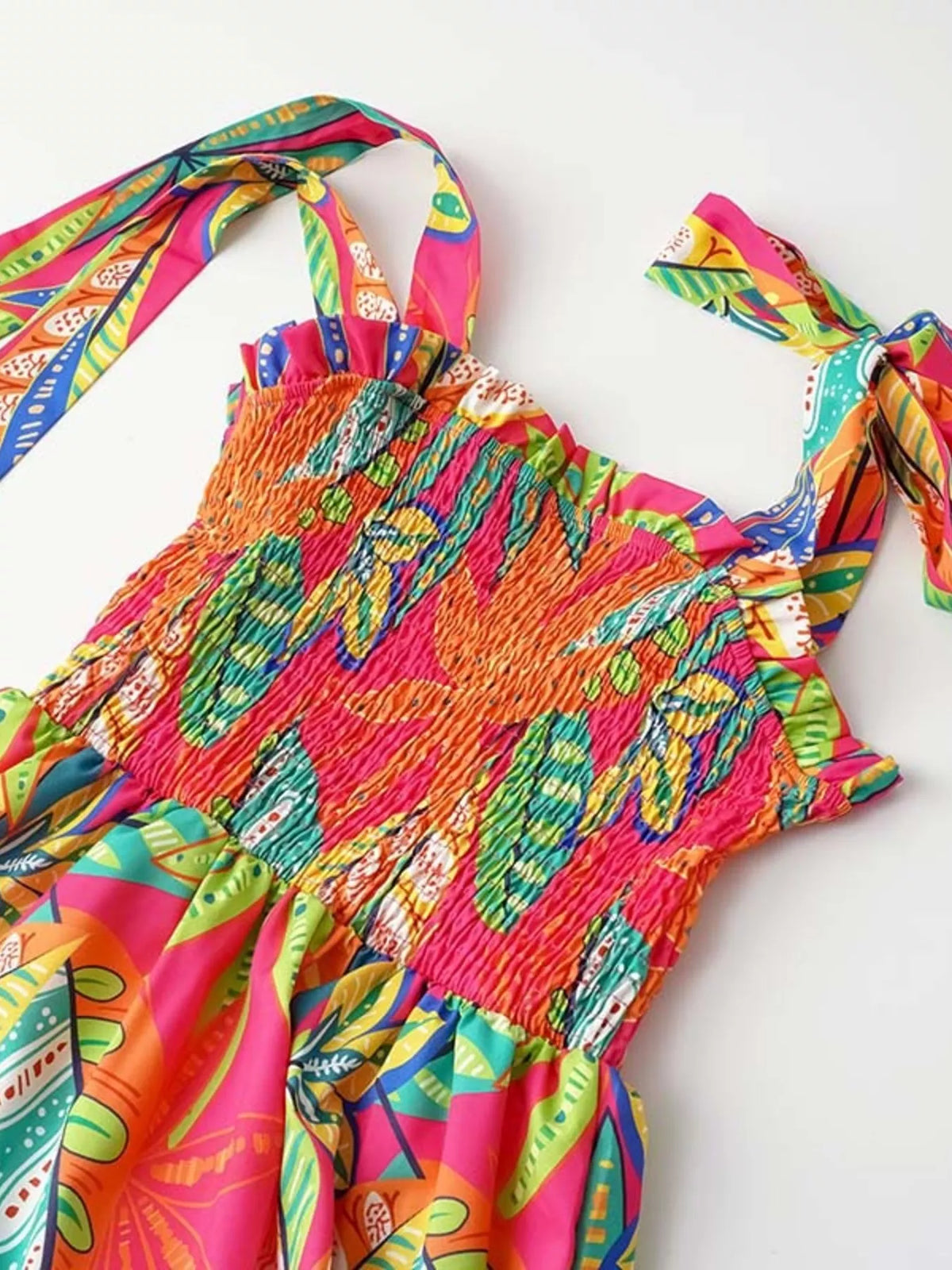 Tropical print smocked tie strap dress front view