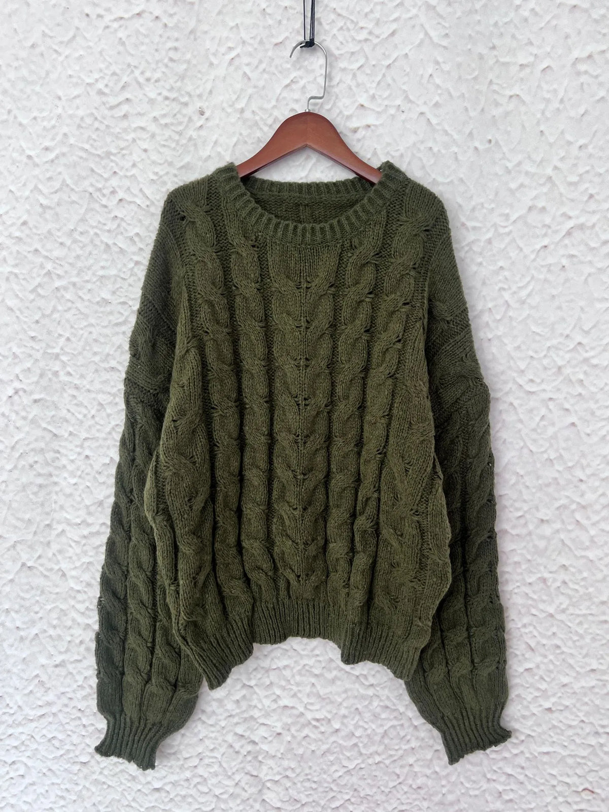 cable knit long sleeve sweater flat lay view