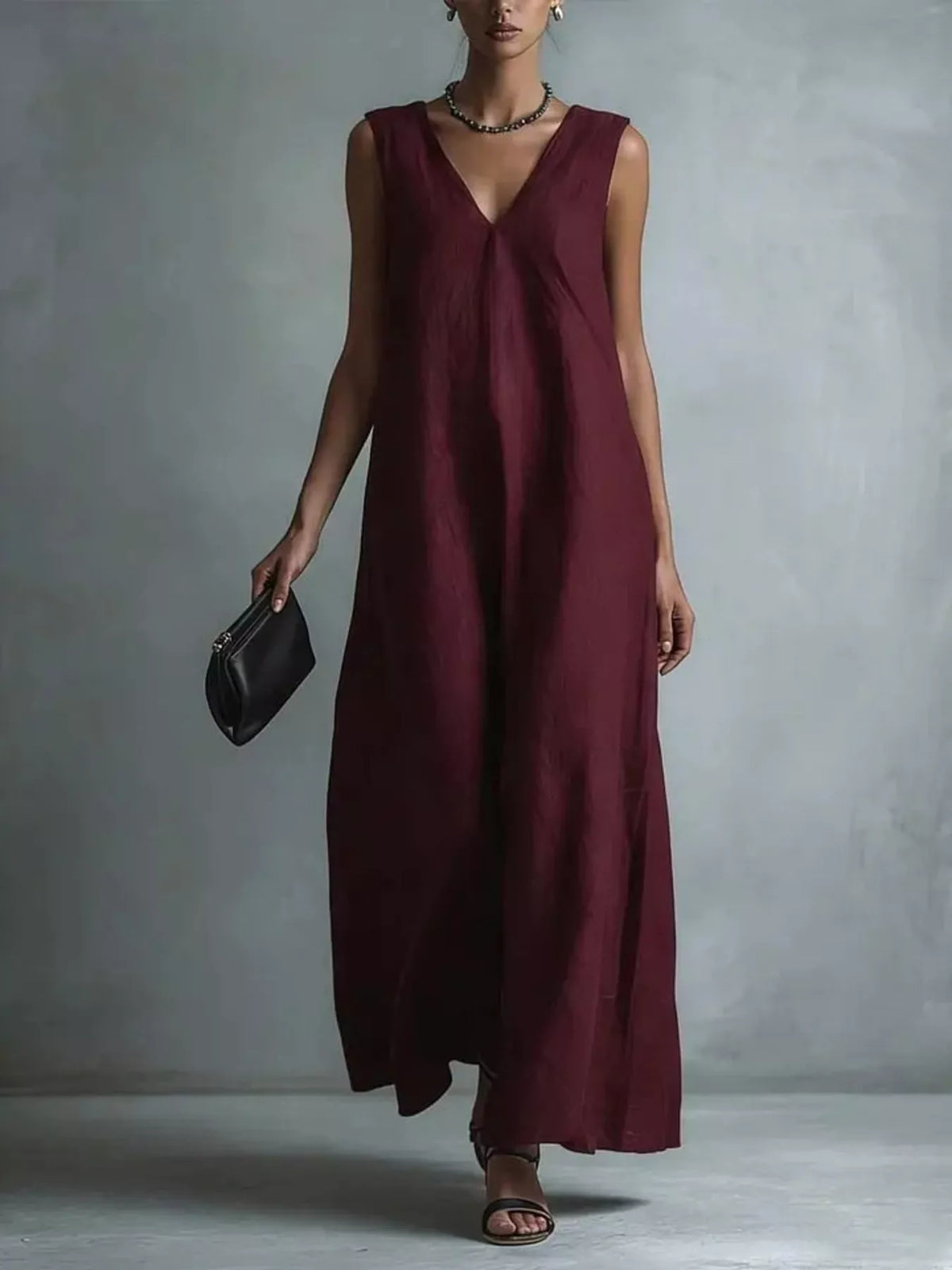 Sleeveless maxi dress photographed full length showing the long relaxed line