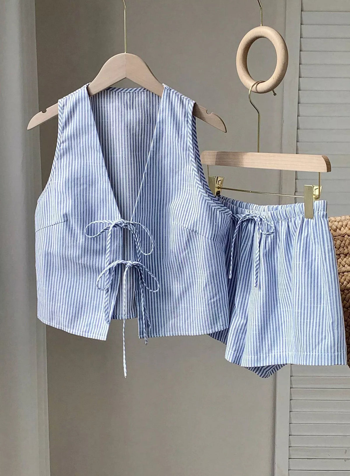 Matching blue striped drawstring shorts close up