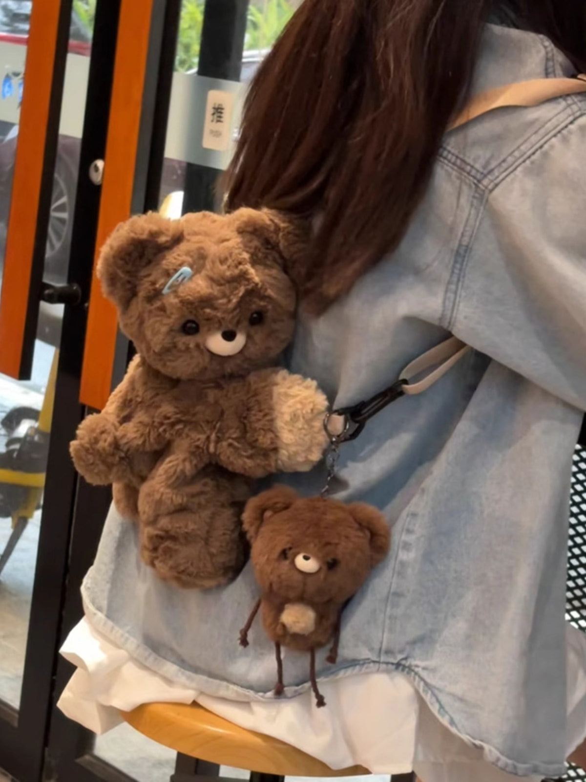 Dark brown plush teddy bear backpack front view
