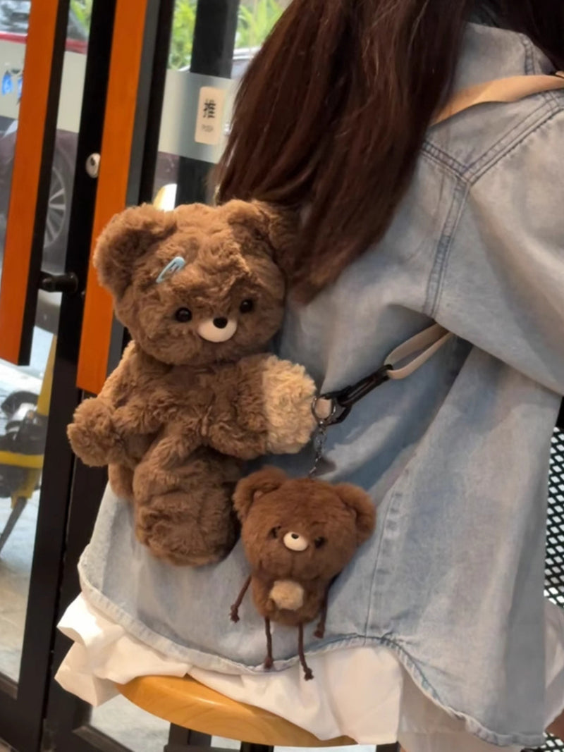 Dark brown plush teddy bear backpack front view