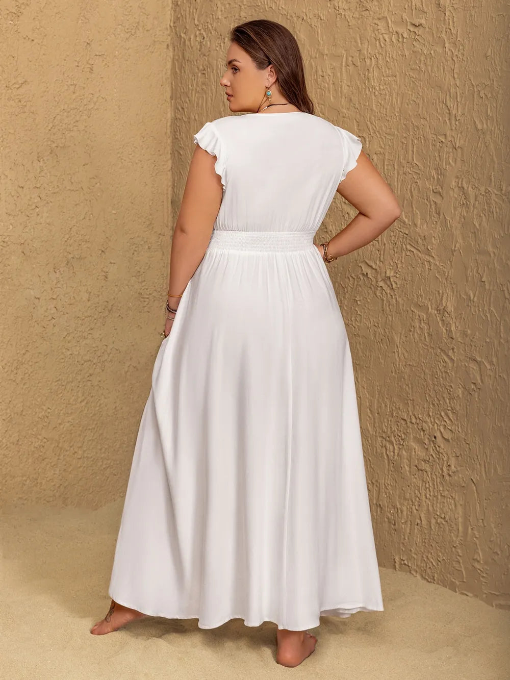 Plus size embroidered floral v neck maxi dress in white detail of the neckline