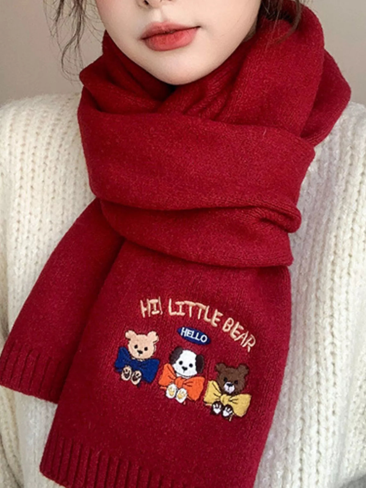 Embroidered cartoon warm scarf shown around the neck