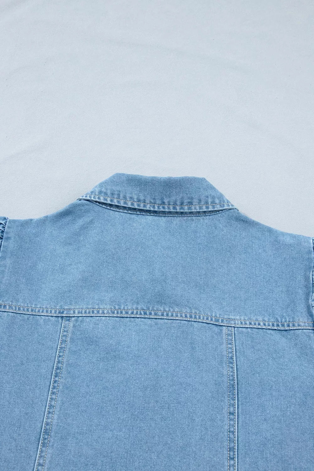light wash puff sleeve ruffle hem denim dress neckline detail