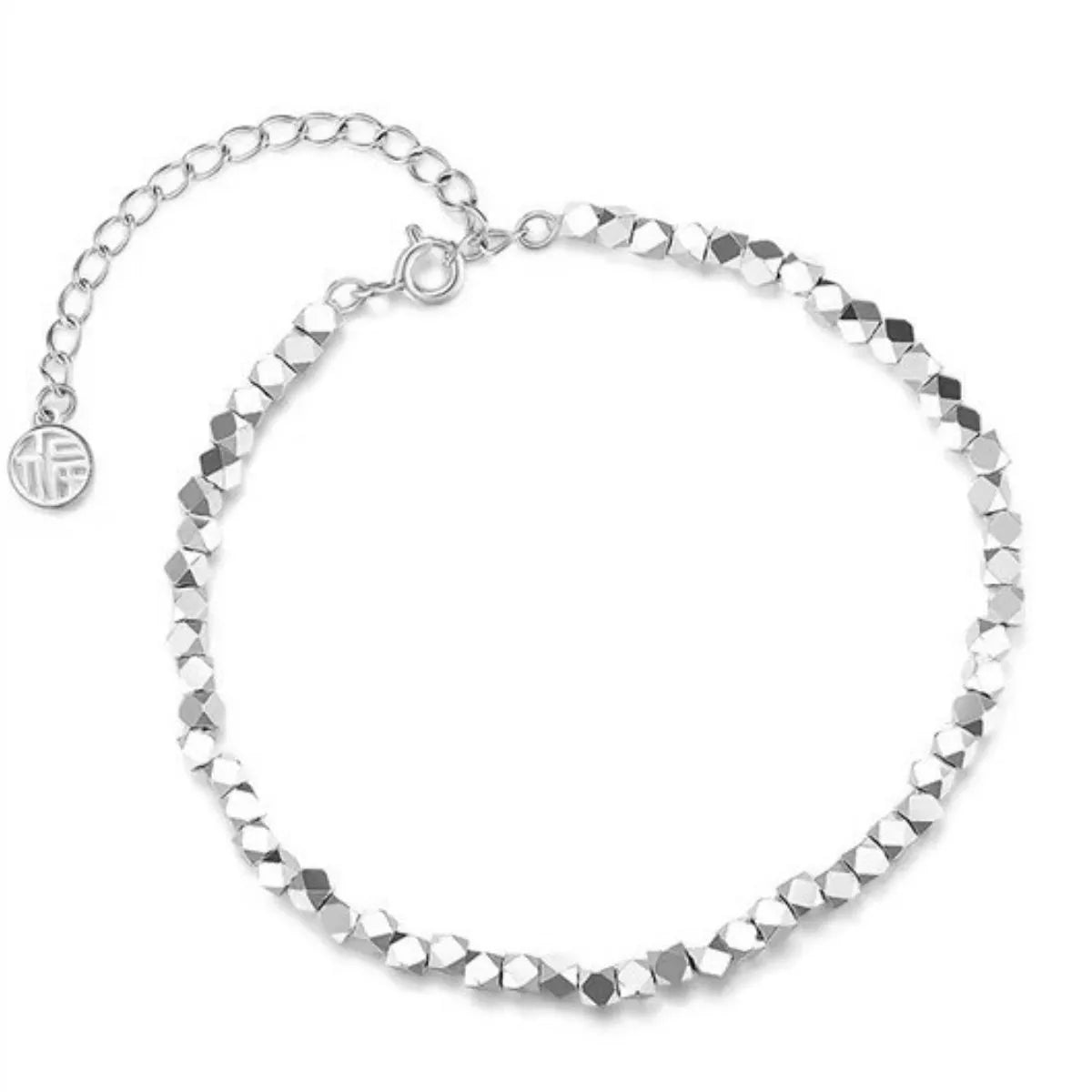 Silver geometric chain bracelet styled on a wrist