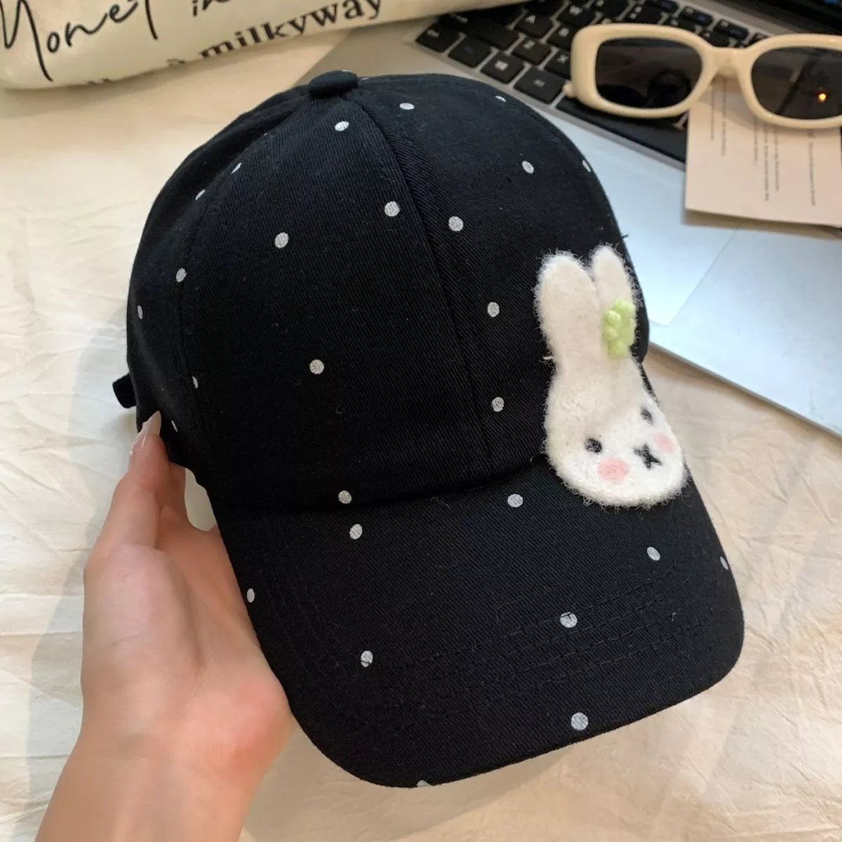 Close up of the bunny motif on the cap front panel