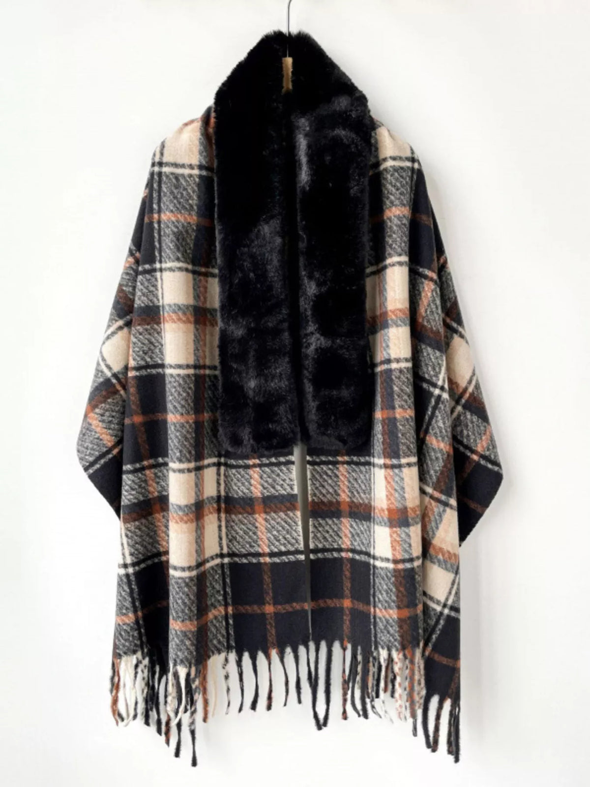 Plush fringe scarf wrap styled for an evening look